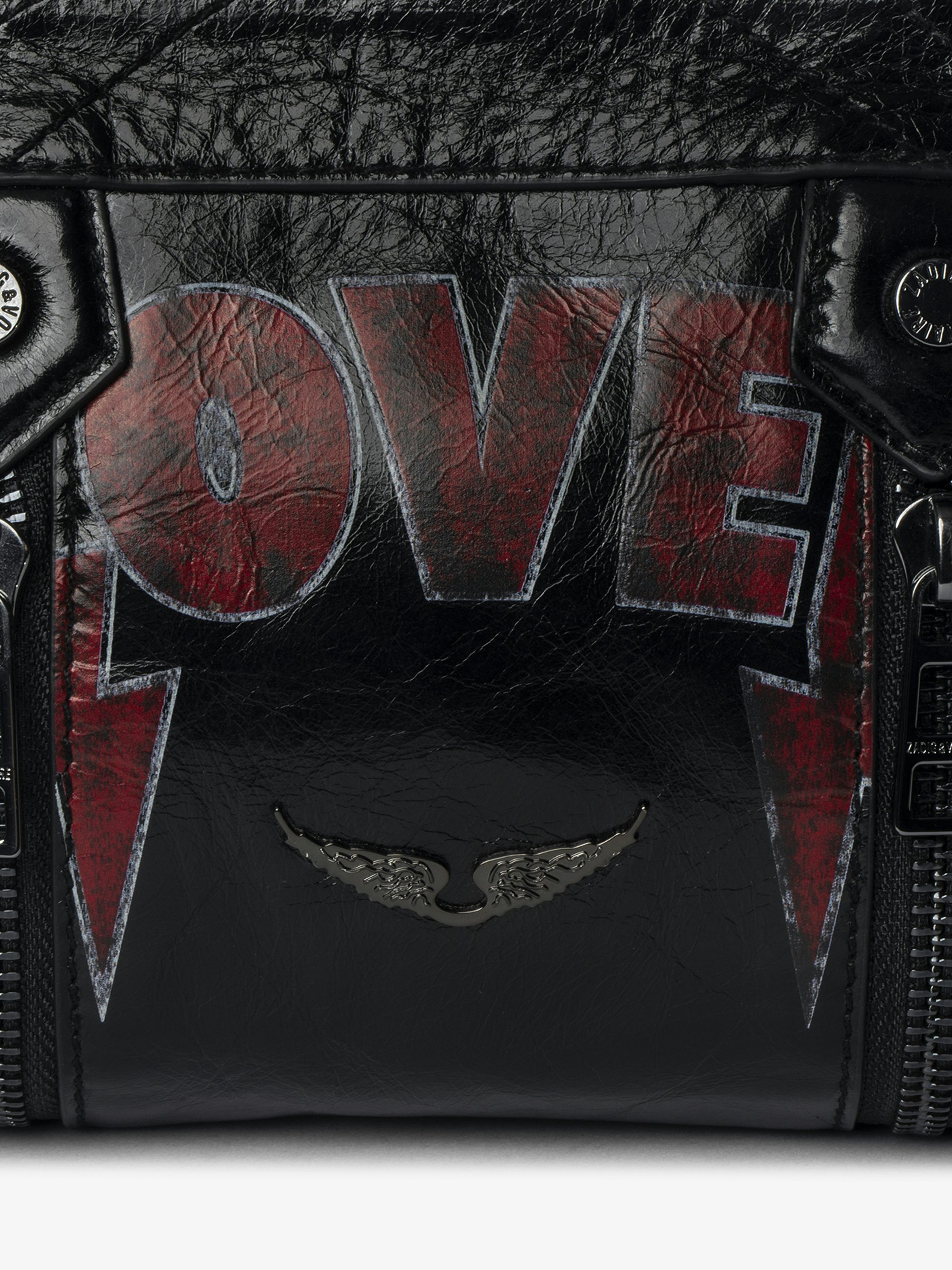 Sunny Mood Punk Bag - Small vintage-inspired patent leather bag with adjustable shoulder strap and punk wings and tag signature.